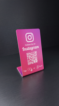 Pink Instagram follow stand with QR code and tap instructions