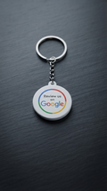 Round white Google review keychain on a keyring