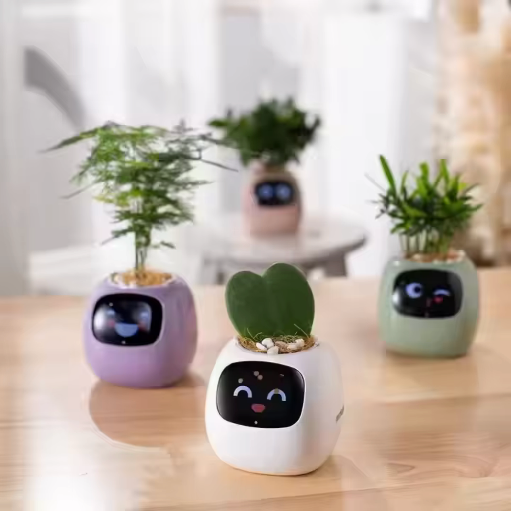Four smart plant pots together on a wooden table